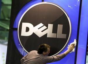A man wipes logo of Dell IT firm at CeBIT exhibition centre in Hannover